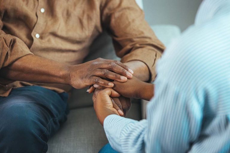 Man and woman supporting each other in recovery