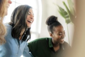 friends laughing during a Relapse Prevention therapy program