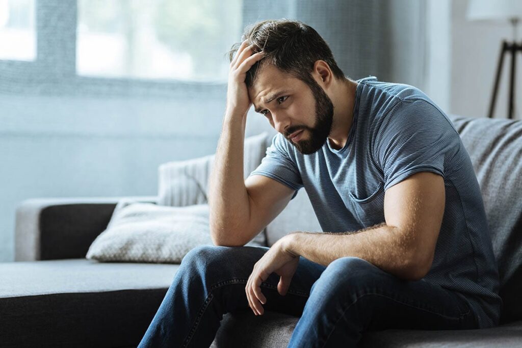 a man struggles to conceal the signs of his drug abuse