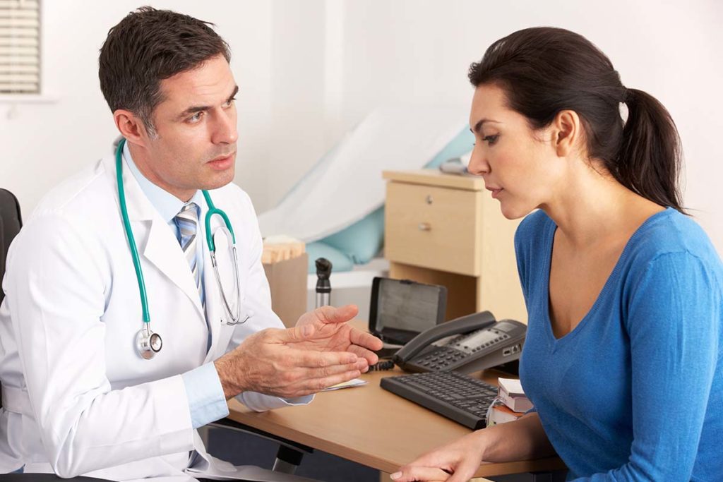 Doctor talking to patient about how addictive is crack