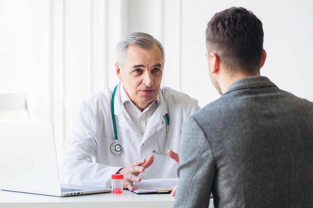 doctor talking to a client in a center for substance abuse treatment