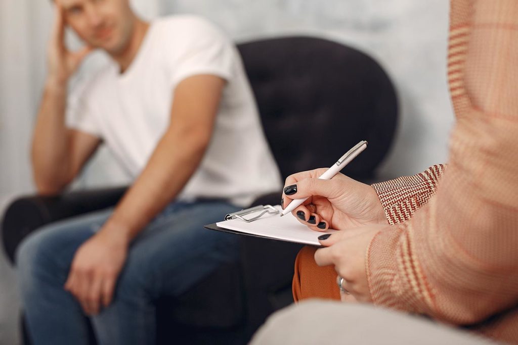 man in jeans in a session of person centered therapy