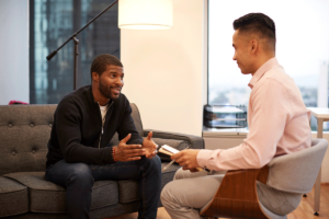 a man begins his first REBT therapy session for mental health treatment