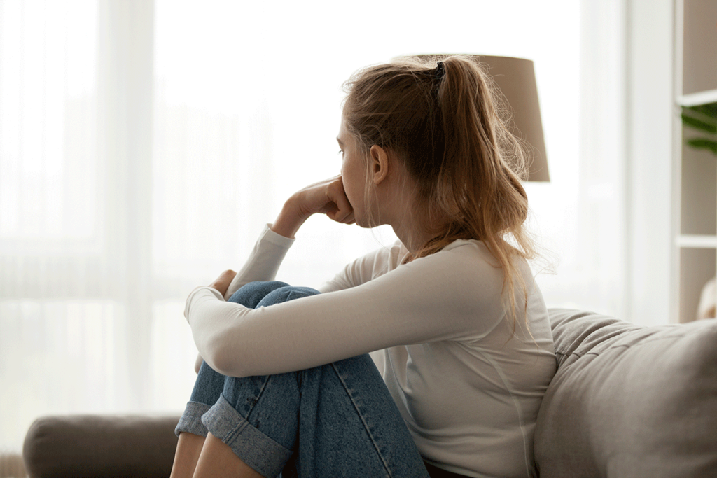 a woman wrestles with the urge to relapse while attempting to detox from drugs at home without professional help