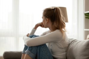 a woman wrestles with the urge to relapse while attempting to detox from drugs at home without professional help
