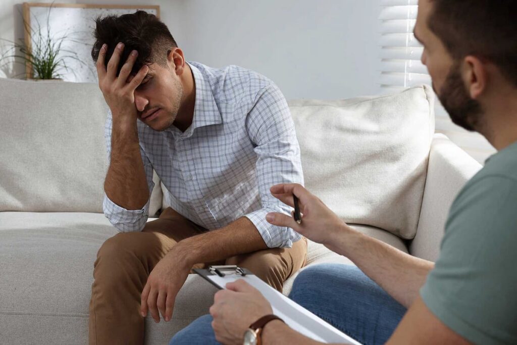 a man begins to open up in co occurring disorder treatment for his addiction and mental health issues