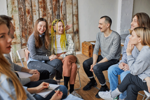individuals in mental health treatment participate in a weekly group therapy session