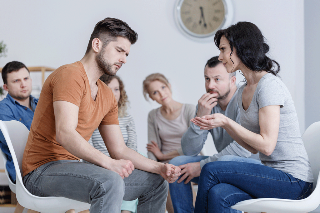 a man learns healthy coping tools in group therapy for anger management