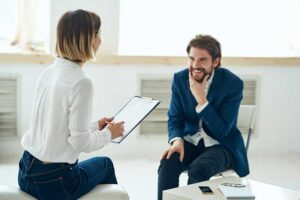 a man enters gender specific mens addiction treatment and meets his new therapist 