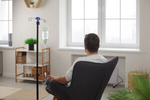 a man receives IV hydration during detoxification in a drug detox center