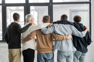 a prescription drug rehab therapy group supports and uplifts each other during a session