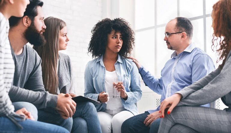 a therapy group in residential treatment for addiction supports each other