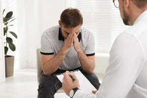 a man releases negative emotions in trauma therapy 