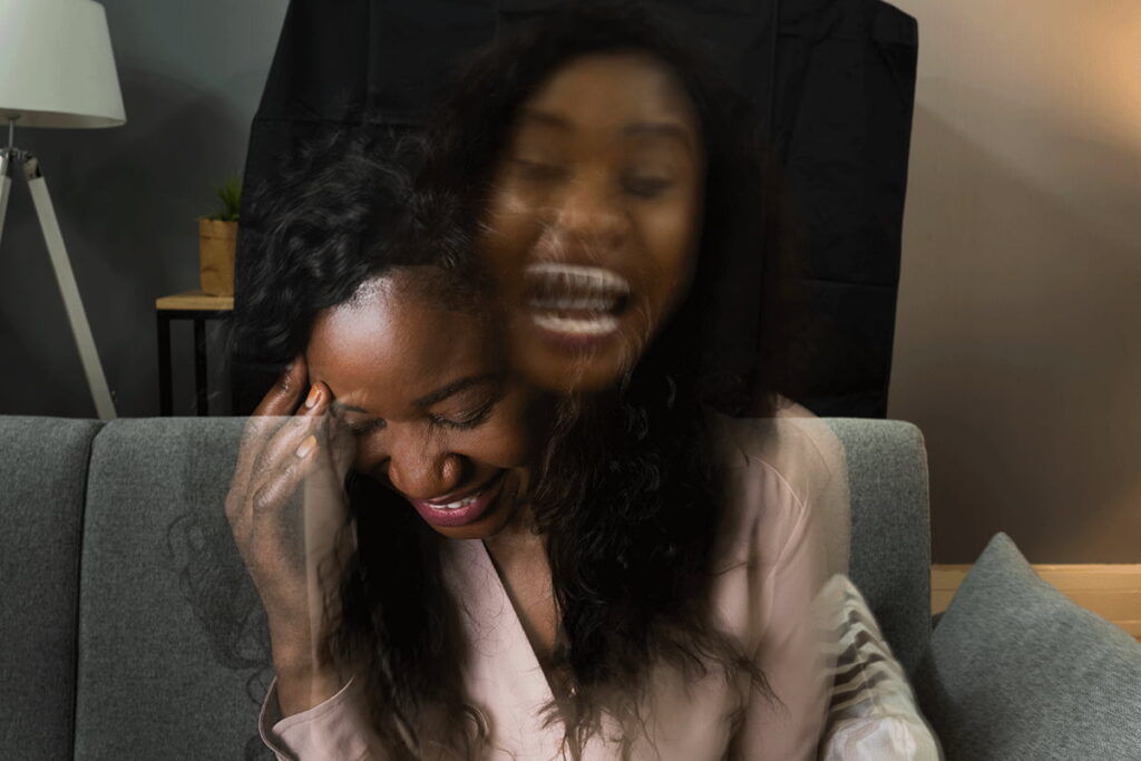 artistic representation of woman with bipolar screaming on the inside