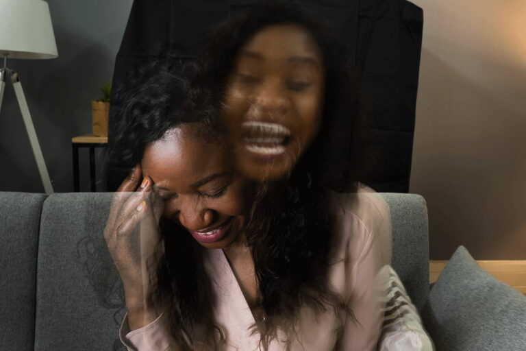 artistic representation of woman with bipolar screaming on the inside