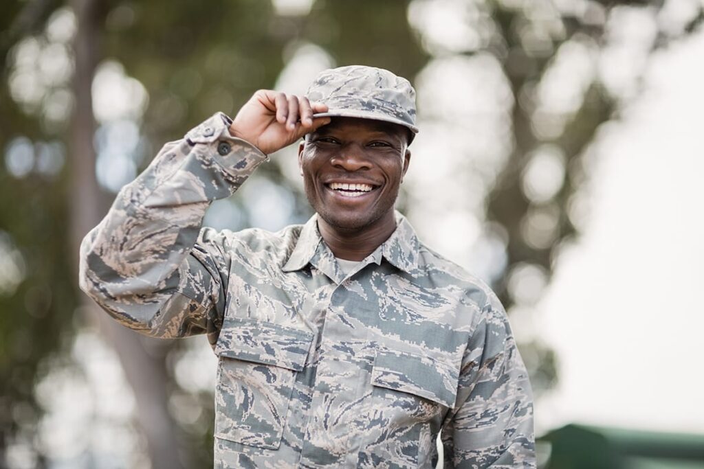 Man saluting in his military uniform