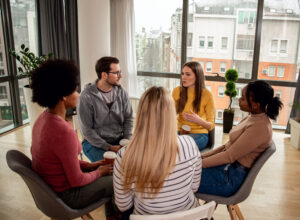 a therapy group meets within an opioid rehab center 
