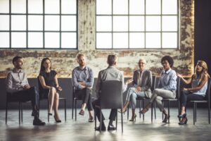 parents and loved ones sitting at an al-anon meeting