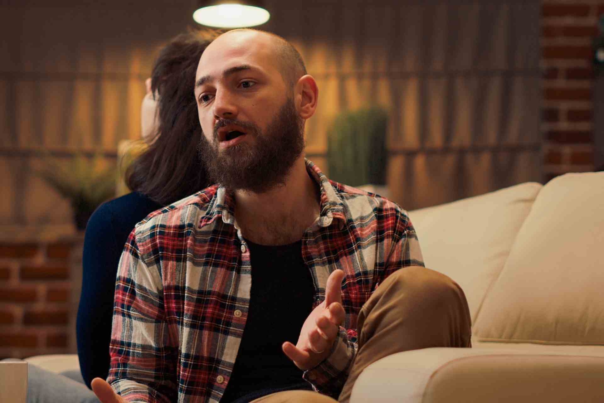 Man speaking during a group counseling session about substance use recovery