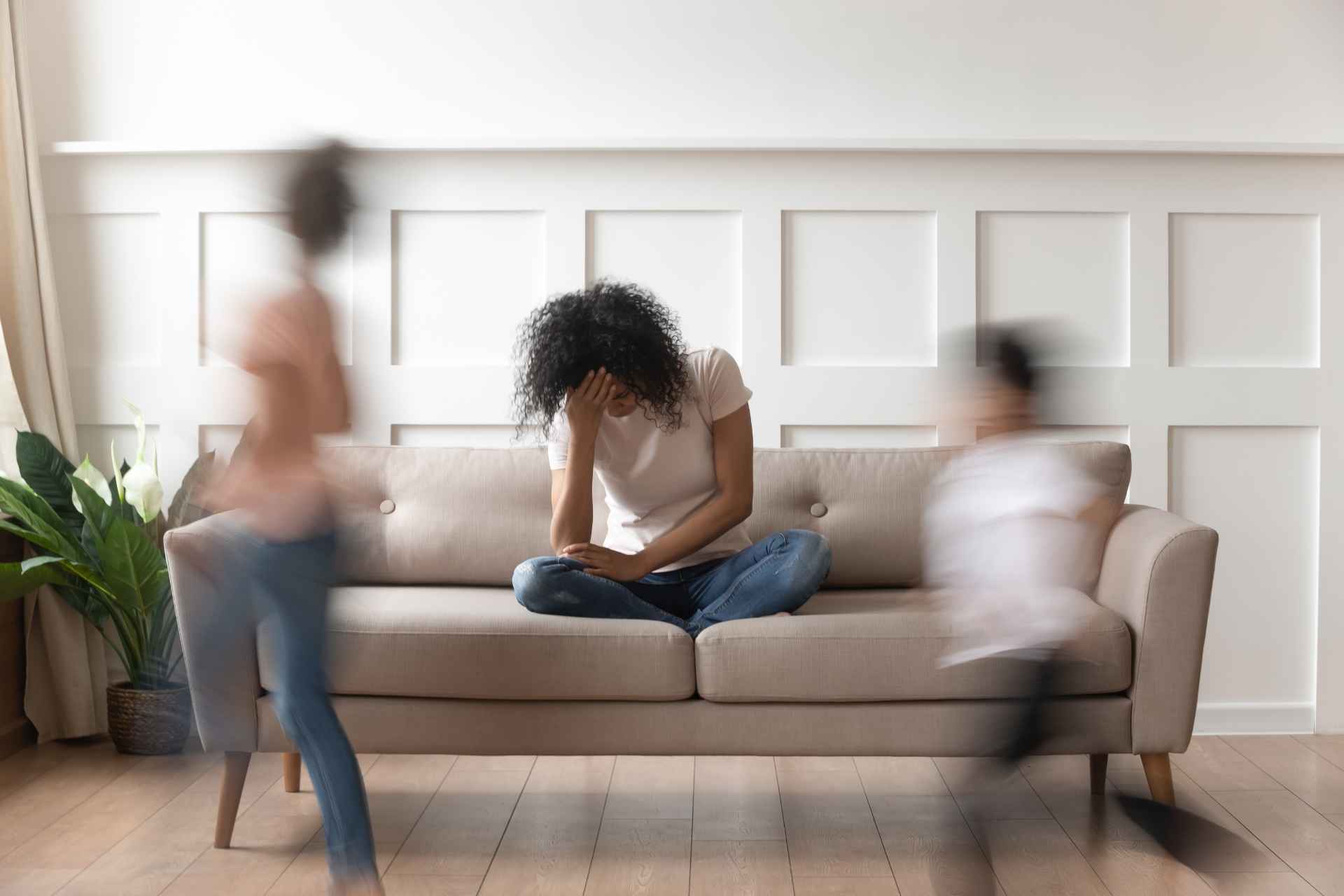 Woman feeling overwhelmed by ADHD and addiction symptoms